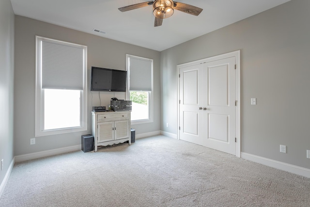 bedroom with visible vents, a ceiling fan, carpet, and baseboards