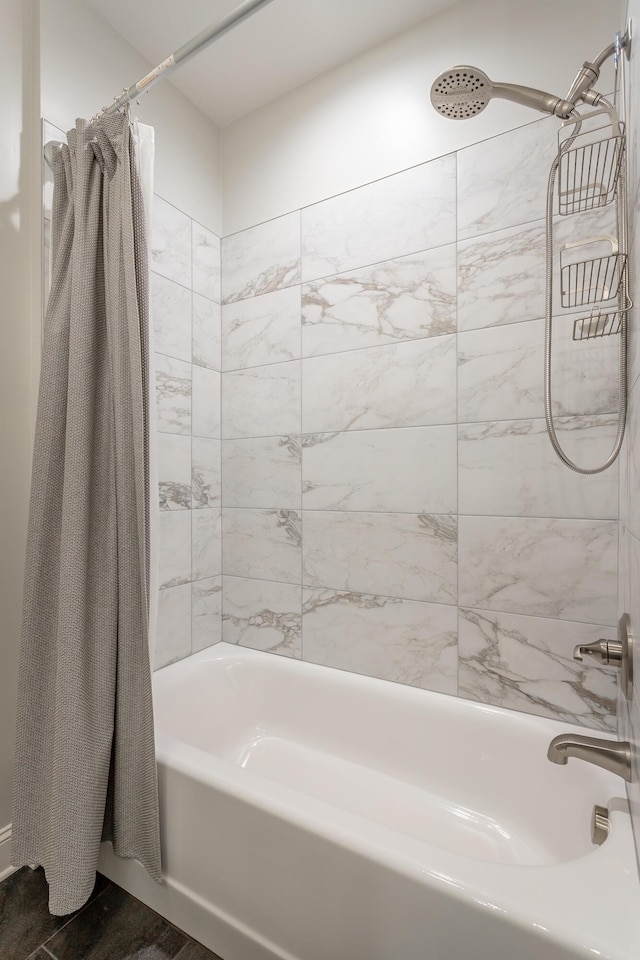 full bathroom featuring wood finished floors and shower / tub combo