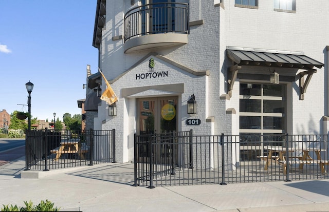 view of building exterior featuring fence