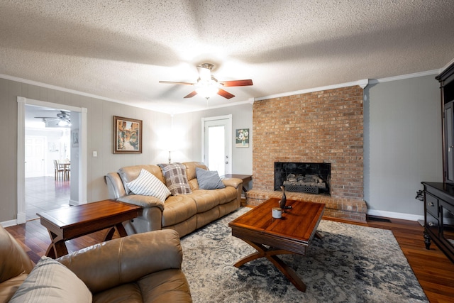living room with crown molding, a ceiling fan, and dark wood-type flooring