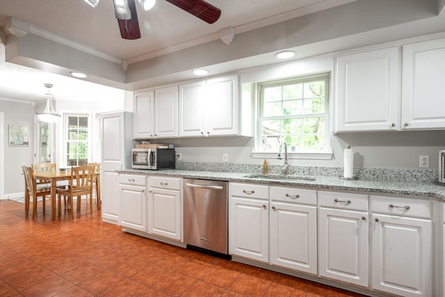kitchen featuring crown molding, white cabinets, appliances with stainless steel finishes, a sink, and a ceiling fan