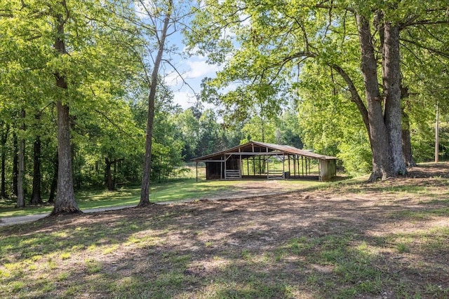 surrounding community featuring a carport and an outdoor structure
