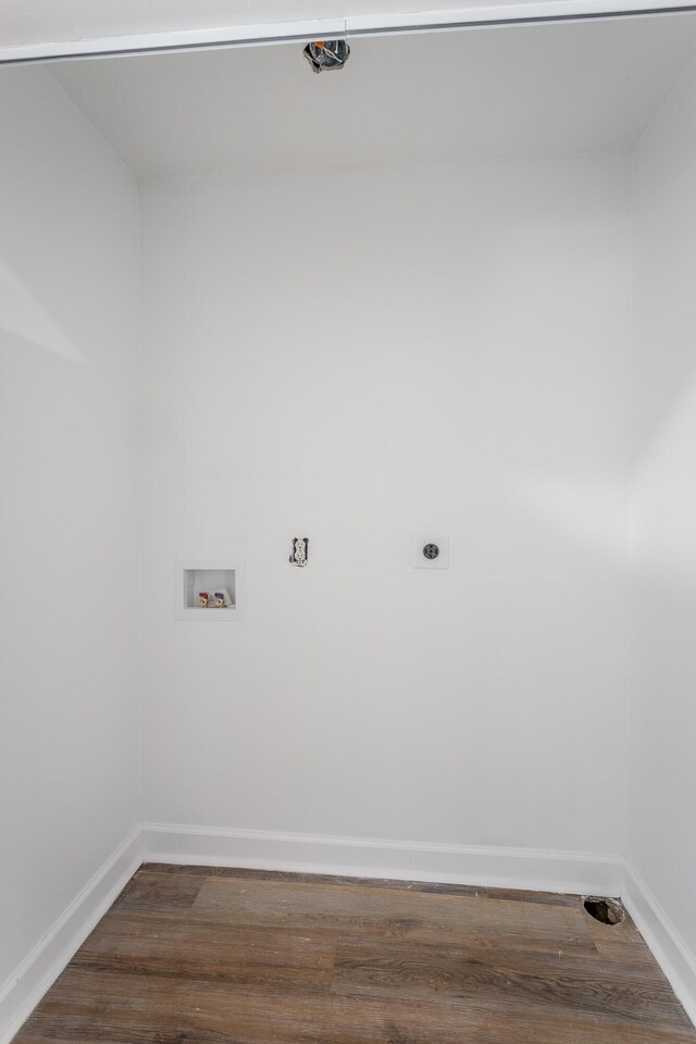 laundry room with laundry area, baseboards, washer hookup, and wood finished floors