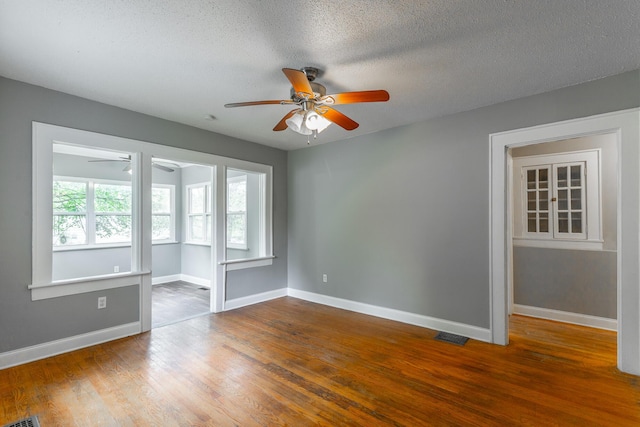 1812 John Ross Rd, Chattanooga, TN 37412 - empty room featuring ceiling fan, baseboards, wood finished floors, and a textured ceiling