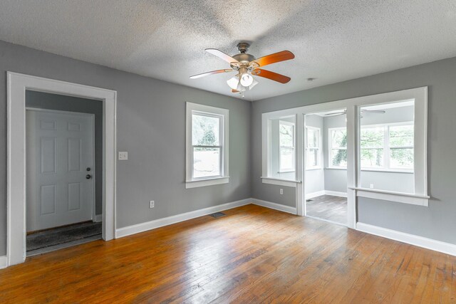 1812 John Ross Rd, Chattanooga, TN 37412 - spare room with ceiling fan, a textured ceiling, hardwood / wood-style floors, and baseboards