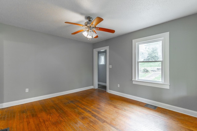 1812 John Ross Rd, Chattanooga, TN 37412 - unfurnished room with baseboards, wood finished floors, ceiling fan, and a textured ceiling