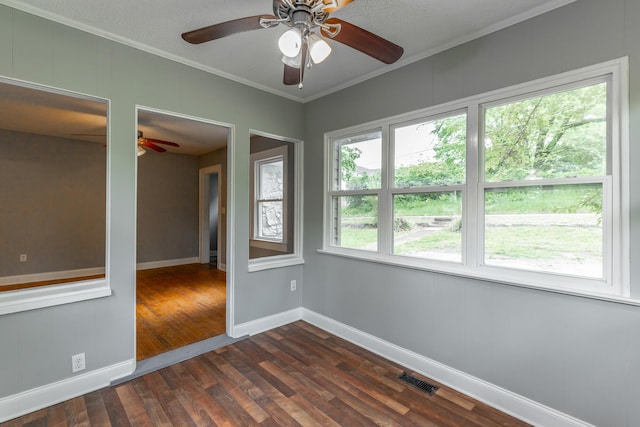 1812 John Ross Rd, Chattanooga, TN 37412 - empty room featuring a ceiling fan, dark wood-style floors, crown molding, and baseboards