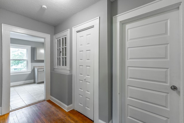 1812 John Ross Rd, Chattanooga, TN 37412 - hall with baseboards, dark wood-type flooring, and a textured ceiling