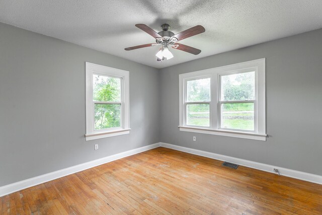 1812 John Ross Rd, Chattanooga, TN 37412 - spare room featuring baseboards, light wood finished floors, ceiling fan, and a textured ceiling