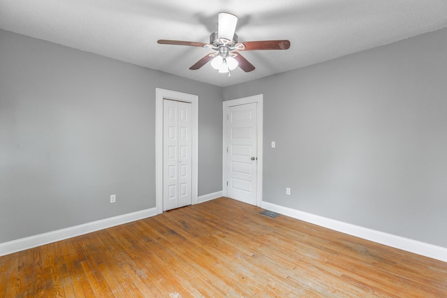 1812 John Ross Rd, Chattanooga, TN 37412 - unfurnished bedroom featuring baseboards, wood finished floors, a closet, and a ceiling fan