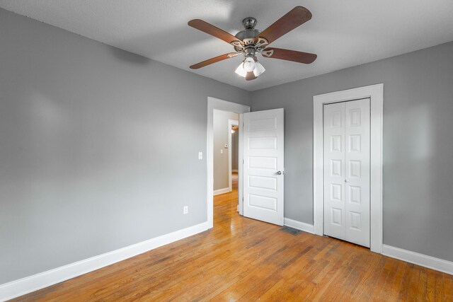 1812 John Ross Rd, Chattanooga, TN 37412 - unfurnished bedroom featuring baseboards, light wood-style flooring, a closet, and ceiling fan