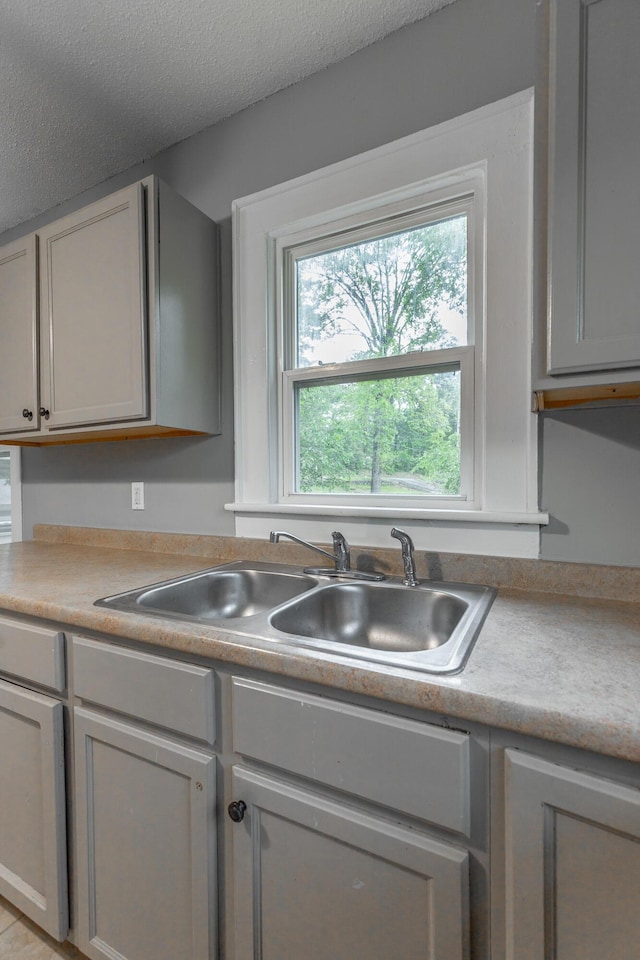 1812 John Ross Rd, Chattanooga, TN 37412 - kitchen with a sink, light countertops, and a textured ceiling