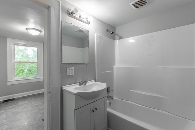 1812 John Ross Rd, Chattanooga, TN 37412 - bathroom with shower / washtub combination, vanity, and baseboards