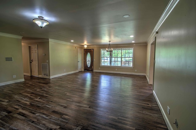unfurnished living room with ornamental molding, dark wood-type flooring, visible vents, and a chandelier