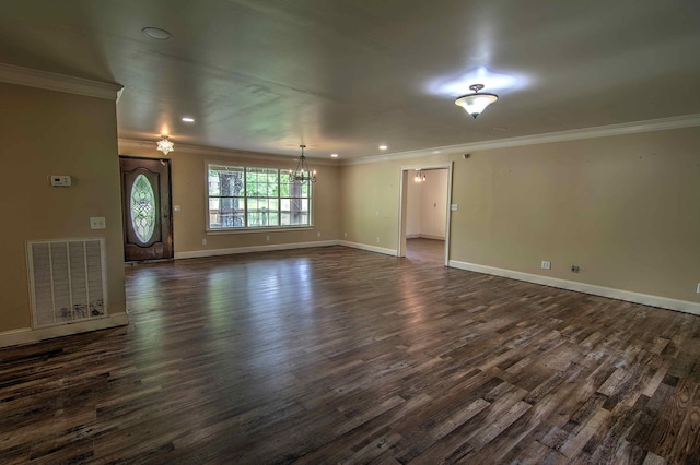 unfurnished living room with ornamental molding, a notable chandelier, dark wood-type flooring, and visible vents