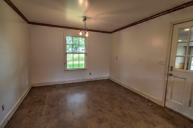 unfurnished dining area with crown molding, baseboards, an inviting chandelier, and visible vents