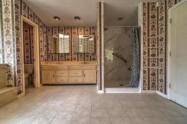 full bathroom with a stall shower, tile patterned flooring, toilet, and wallpapered walls
