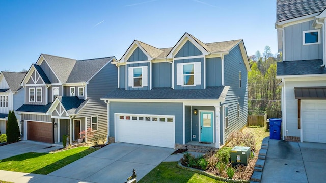 1826 Seven Pines Ln, Chattanooga, TN 37415 - view of front of property with board and batten siding, driveway, and an attached garage