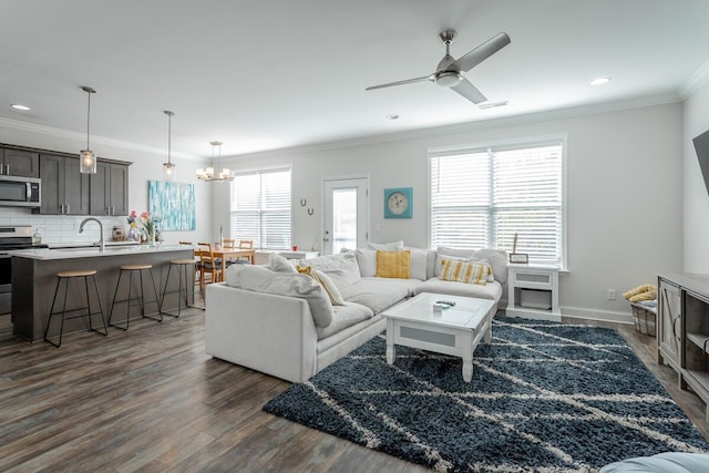 1826 Seven Pines Ln, Chattanooga, TN 37415 - living room featuring dark wood-style floors, crown molding, ceiling fan, recessed lighting, and a chandelier