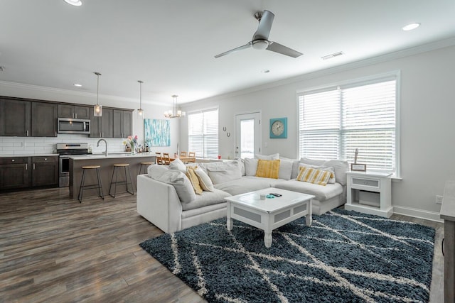 1826 Seven Pines Ln, Chattanooga, TN 37415 - living room with crown molding, dark wood-style floors, a ceiling fan, recessed lighting, and a chandelier