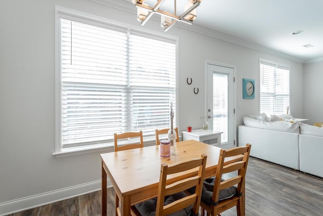 1826 Seven Pines Ln, Chattanooga, TN 37415 - dining space with a chandelier, dark wood-style floors, healthy amount of natural light, crown molding, and baseboards
