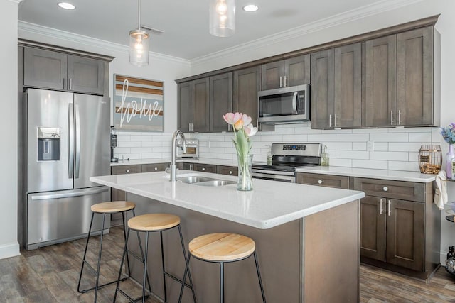 1826 Seven Pines Ln, Chattanooga, TN 37415 - kitchen featuring stainless steel appliances, tasteful backsplash, light countertops, dark wood finished floors, and ornamental molding