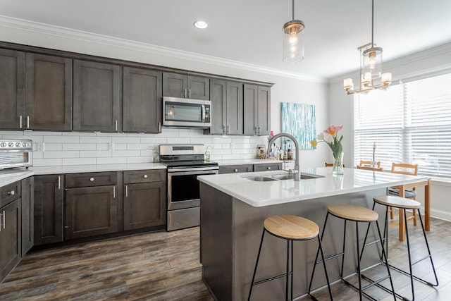 1826 Seven Pines Ln, Chattanooga, TN 37415 - kitchen featuring stainless steel appliances, a sink, ornamental molding, decorative backsplash, and dark brown cabinetry