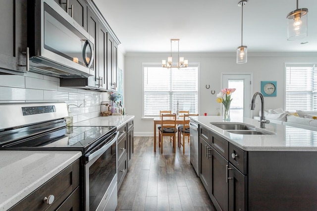 1826 Seven Pines Ln, Chattanooga, TN 37415 - kitchen featuring stainless steel appliances, a sink, crown molding, tasteful backsplash, and dark wood finished floors