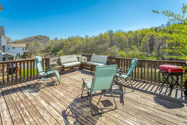 1826 Seven Pines Ln, Chattanooga, TN 37415 - wooden terrace featuring a forest view, outdoor lounge area, and outdoor dining area