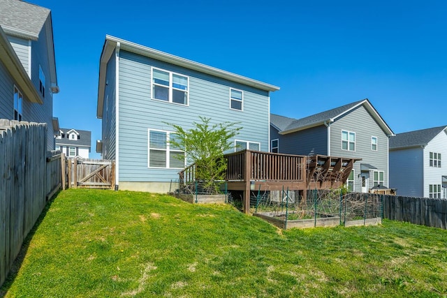 1826 Seven Pines Ln, Chattanooga, TN 37415 - back of property featuring a vegetable garden, a gate, and a deck