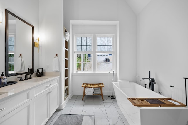613 Ladd Ave, Chattanooga, TN 37405 - full bathroom with lofted ceiling, a soaking tub, marble finish floor, and vanity