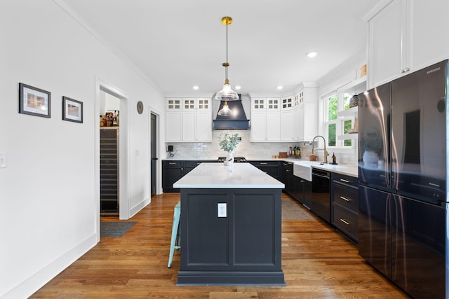 613 Ladd Ave, Chattanooga, TN 37405 - kitchen featuring dishwasher, a sink, premium range hood, freestanding refrigerator, and ornamental molding