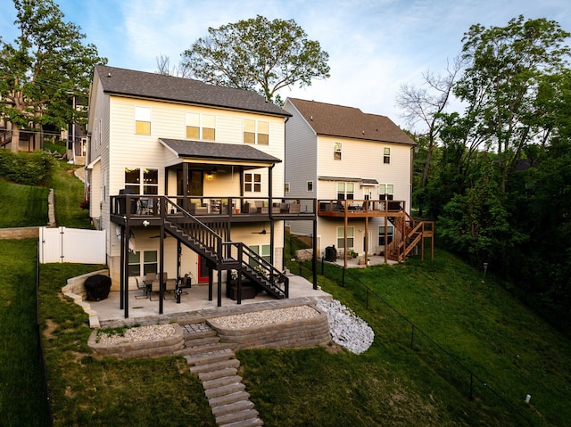 613 Ladd Ave, Chattanooga, TN 37405 - back of property featuring a fenced backyard, a deck, a patio area, and stairway
