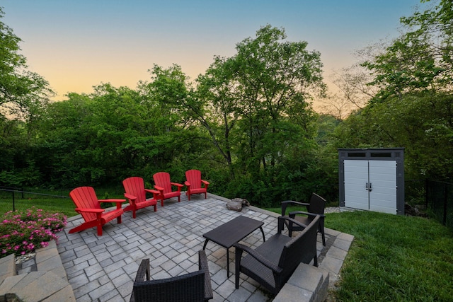 613 Ladd Ave, Chattanooga, TN 37405 - view of patio / terrace featuring an outbuilding, a fire pit, fence, and a storage shed