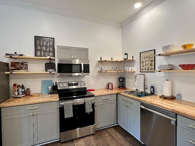 613 Ladd Ave, Chattanooga, TN 37405 - kitchen featuring open shelves, a sink, appliances with stainless steel finishes, and gray cabinetry