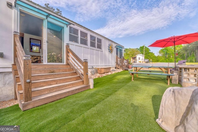 view of yard featuring entry steps