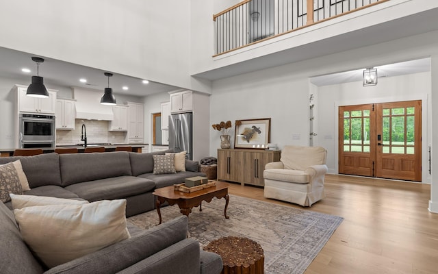 6949 Sawyer Rd, Signal Mountain, TN 37377 - living room featuring light wood-style floors, a high ceiling, and recessed lighting