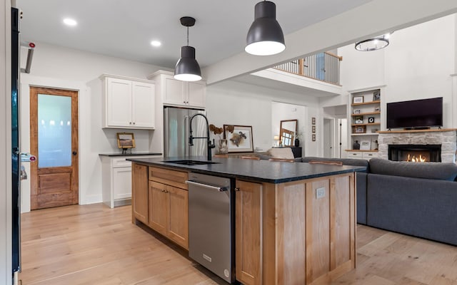 6949 Sawyer Rd, Signal Mountain, TN 37377 - kitchen featuring open floor plan, dark countertops, light wood-type flooring, white cabinets, and stainless steel dishwasher