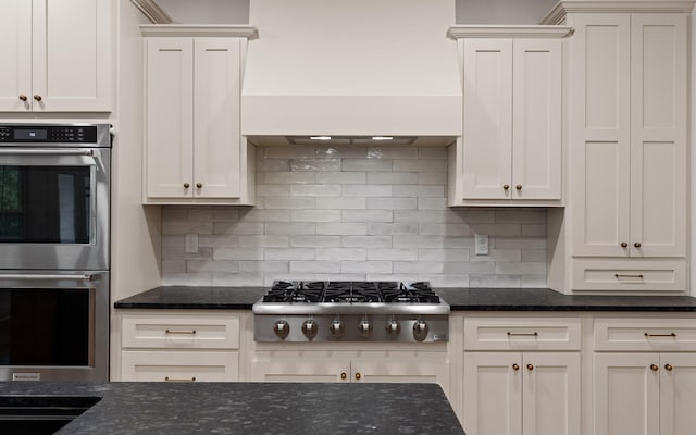 6949 Sawyer Rd, Signal Mountain, TN 37377 - kitchen with appliances with stainless steel finishes, custom exhaust hood, tasteful backsplash, and white cabinetry