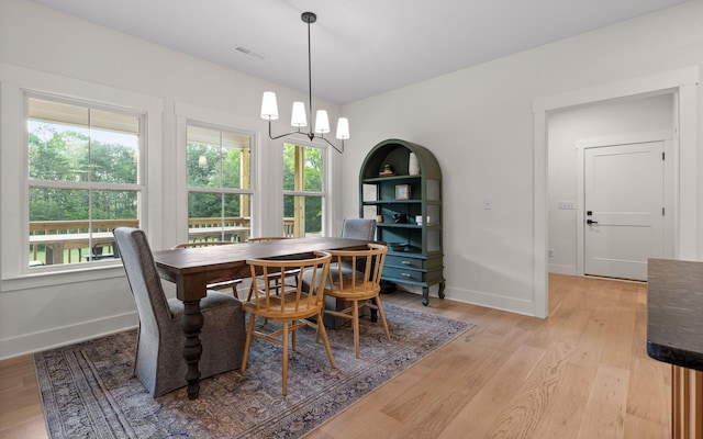 6949 Sawyer Rd, Signal Mountain, TN 37377 - dining room with light wood finished floors and a chandelier