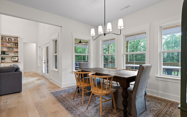 6949 Sawyer Rd, Signal Mountain, TN 37377 - dining area featuring light wood-style flooring and a chandelier
