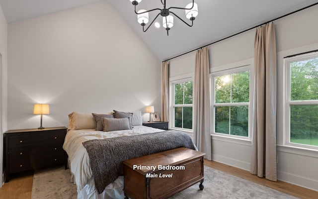 6949 Sawyer Rd, Signal Mountain, TN 37377 - bedroom with a chandelier, wood finished floors, and high vaulted ceiling