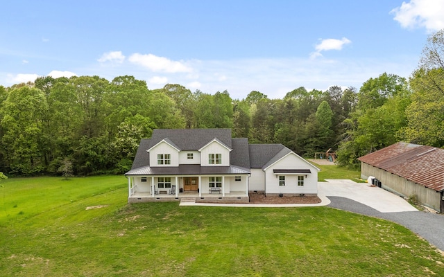 6949 Sawyer Rd, Signal Mountain, TN 37377 - modern farmhouse with covered porch, asphalt driveway, a front lawn, crawl space, and a wooded view