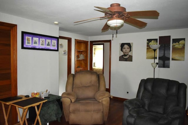 living area with ceiling fan