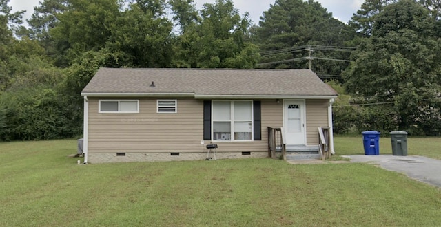 view of front facade with crawl space and a front yard