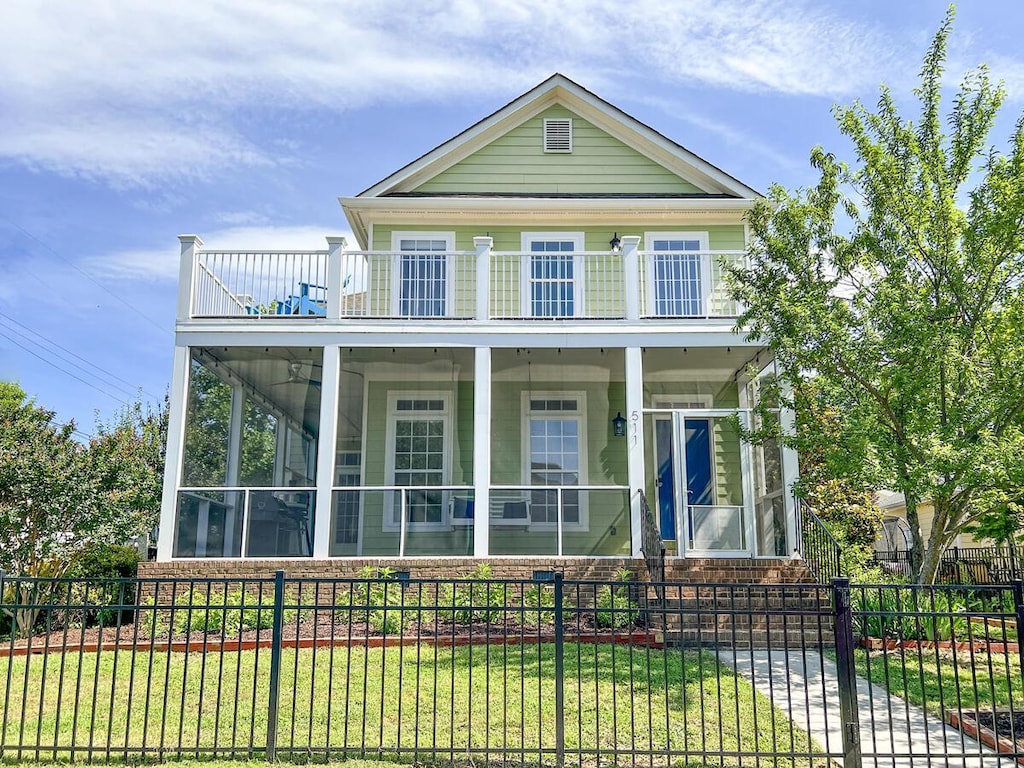 511 Colby St, Chattanooga, TN 37405 - view of front of house featuring a balcony and a sunroom