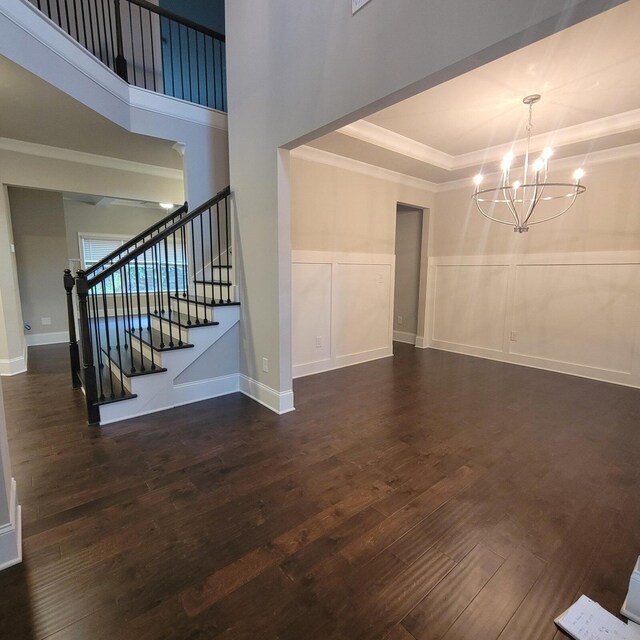 9573 Hastings Way, Ooltewah, TN 37363 - interior space featuring crown molding, wainscoting, wood finished floors, stairway, and a notable chandelier