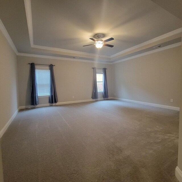 9573 Hastings Way, Ooltewah, TN 37363 - unfurnished room featuring a raised ceiling, ceiling fan, ornamental molding, and baseboards