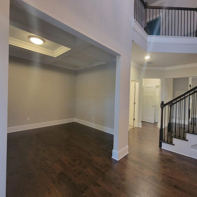 9573 Hastings Way, Ooltewah, TN 37363 - below grade area with crown molding, baseboards, stairway, and wood finished floors