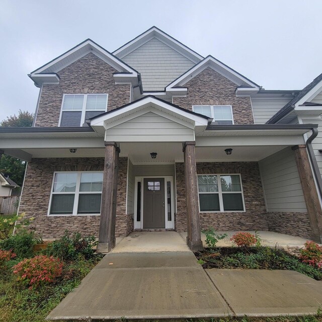 9573 Hastings Way, Ooltewah, TN 37363 - craftsman house with covered porch and stone siding